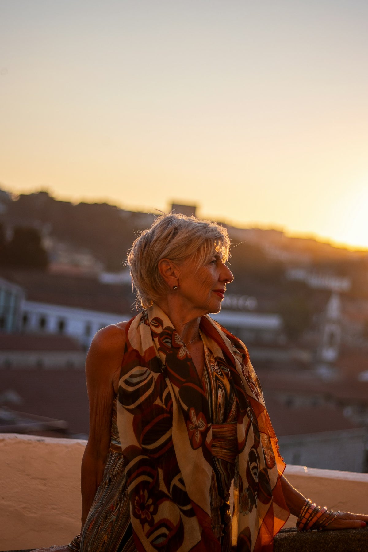 Woman in a printed dress at sunset